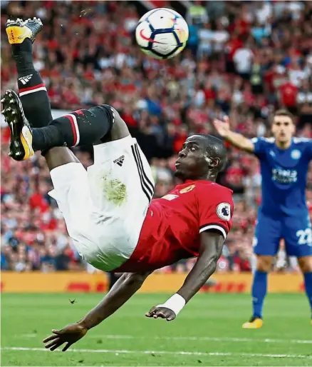  ?? — Reuters ?? Daredevil: Manchester United’s Eric Bailly attempts an overhead kick in the English Premier League match against Leicester on Aug 26. United won 2- 0.