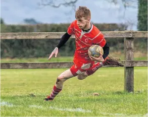  ?? PICTURES: Artur Lesniak ?? Corsham’s 2nd XV run in a try, but could not halt the imperious unbeaten record of Frome 2nds in a 26-13 loss