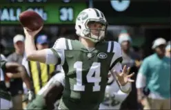  ?? BILL KOSTROUN — THE ASSOCIATED PRESS ?? New York Jets’ Sam Darnold (14) throws a pass during the first half of an NFL football game against the Miami Dolphins Sunday in East Rutherford, N.J.