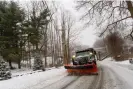  ?? Photograph: Kristopher Radder/AP ?? A snowplow removes the snow on Maple Street in Brattlebor­o, Vermont, on 23 March 2024.