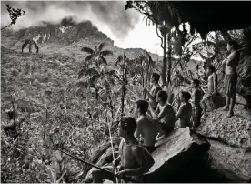  ??  ?? Holy mountain … Yanomani from the community of Maturaca, looking to a mountain where they believe a god lives. Photograph: Sebastião Salgado/© Sebastião Salgado