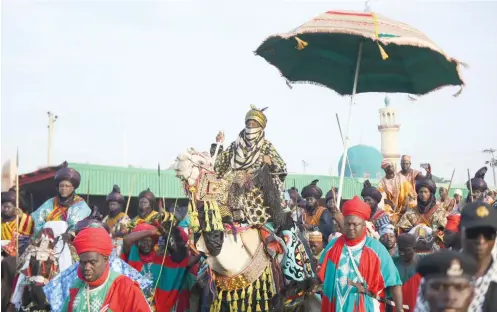  ?? Photo: Sani Maikatanga ?? Emir of Kano Muhammadu Sanusi II on top of a camel during the Daushe Sallah Durbar celebratio­n in honor of President Alpha Condé of Guinea at Kofar Kudu Emir’s Palace in Kano yesterday