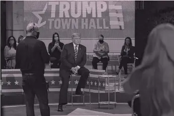  ?? EVAN VUCCI/ AP ?? President Donald Trump sits during a break at his NBC town hall in Miami on Thursday.