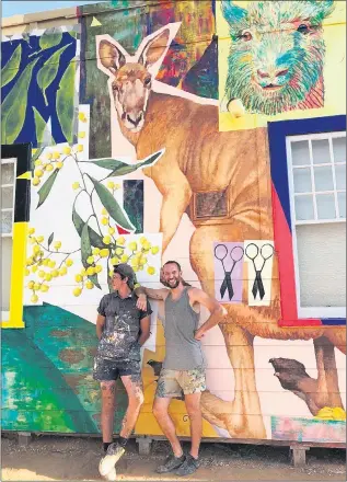 ??  ?? ALMOST READY: Melbourne artist Kitt Bennett, left, and French-based artist JAW in front of a mural they painted at Beulah earlier this year. Bennett has finalised his concept designs to start painting a privately owned silo at Albacutya.