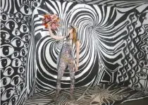  ??  ?? A WOMAN poses in an abstract gallery during the 29Rooms exhibition on Sept. 10, in New York. Writing on walls, diving into foam cubes or becoming a living picture, the 29Rooms exhibition in New York offered visitors the opportunit­y to interact with art...