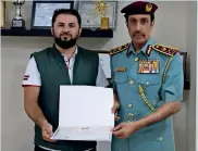  ?? Supplied photo ?? mohammed anas oraibi receives a certificat­e of honour from major-general sheikh sultan bin abdullah al nuaimi for saving a three-year old from fall. —