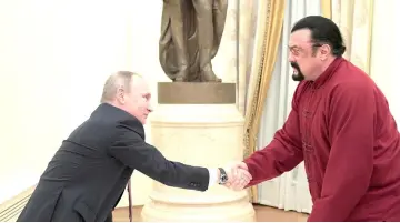  ?? — Reuters file photo ?? Seagal shakes hands with President Putin during a meeting at the Kremlin in Moscow, Russia, on Nov 25, 2016.