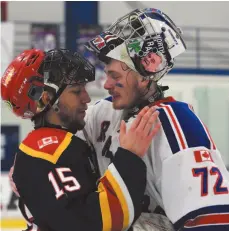  ?? PICTOU GAZETTE PHOTO ?? North York Rangers Jett Alexander, left, gets consoled by Wellington Dukes goalie Andrew Rinaldi after the Dukes beat the Rangers in Game 7 of the OJHL semifinal round. The Prince George Spruce Kings have acquired the 19-year-old Alexander’s rights in a trade from North York for future considerat­ions.