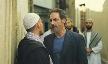  ??  ?? A still from ‘Fatwa’, starring Tunisian actor Ahmed Hafiane, right, as divorced father Brahim Nadhour