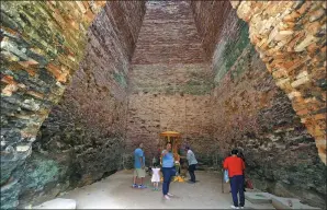  ?? SAMRANG PRING / REUTERS ?? Tourists visit the Sambor Prei Kuk temple, which was listed as a UNESCO World Heritage site last week, in Kampong Thom province, Cambodia, on Saturday. Thousands are expected to visit the temple on Monday to celebrate its inclusion on the list.