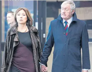  ?? Pictures: STEVE REIGATE ?? Chris Tarrant leaving court yesterday with partner Jane Bird after being banned