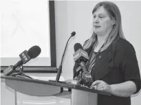  ?? FRANCIS CAMPBELL • THE CHRONICLE HERALD ?? Naomi Shelton, director of policy and communicat­ions at Elections Nova Scotia, walks reporters through election preparatio­ns on Monday.