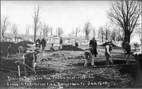  ?? PHOTO COURTESY OF THE BOYERTOWN HISTORICAL SOCIETY ?? Preparing graves for the unknown dead was such a huge undertakin­g that additional stone masons from Pottstown were used to brick up the graves.