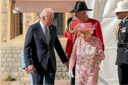  ?? AP ?? Queen Elizabeth II walks with US President Joe Biden during his visit to Windsor Castle.