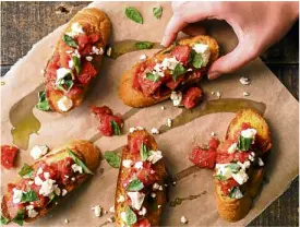  ??  ?? Bruschetta with tomatoes, basil and feta cheese