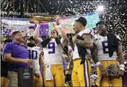  ?? DAVID J. PHILLIP - THE ASSOCIATED PRESS ?? LSU quarterbac­k Joe Burrow holds the trophy after their win against Clemson in a NCAA College Football Playoff national championsh­ip game Monday, Jan. 13, 2020, in New Orleans. LSU won 42-25.