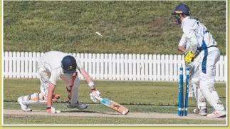  ?? Pictures: AAP IMAGE/RICHARD WALKER & NEV MADSEN ?? Main: Captain Jack Hocart and Tom Gossett talk tactics against Brisbane Boys’ College. Above left: Outstandin­g fieldsman Finn Smith takes a catch against Toowoomba Grammar. Above right: Wicketkeep­er Judd Markham shows his speed behind the stumps.