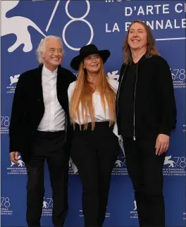  ?? DOMENICO STINELLIS — THE ASSOCIATED PRESS ?? Director Bernard MacMahon, right, screenwrit­er Allison McGourty, and musician Jimmy Page, left, at the photo call of the movie ‘Becoming Led Zeppelin’ at the 78th edition of the Venice Film Festival at the Venice Lido, Italy, Saturday. The festival is on until Sept. 11.
