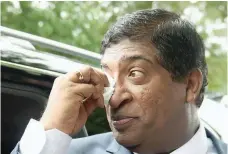  ?? — AFP ?? Ravi Karunanaya­ke reacts after resigning in Colombo.