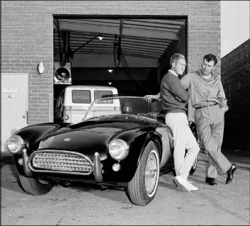 ?? Dick Stroebel The Associated Press file ?? Academy Award-nominated actor Steve McQueen, left, and automobile designer Carroll Shelby stand by McQueen’s Ford-Cobra roadster in 1963 in Los Angeles.