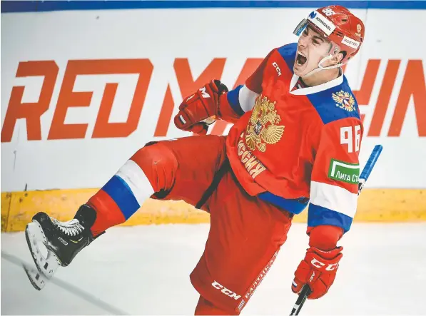  ?? —ALEXANDER NEMENOV/AFP/GETTY IMAGES FILES ?? Will Scouch of McKeen's Hockey says KHL free agent Andrei Kuzmenko has offensive skills that, put together, make him `a devastatin­g player with the puck.'