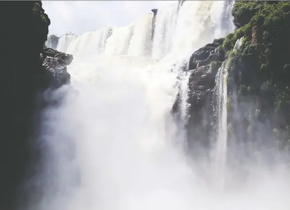  ??  ?? A roaring spectacle: One of the approximat­ely 275 waterfalls on the border between Brazil and Argentina is a sight to behold.