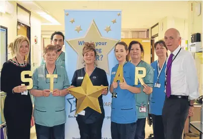  ??  ?? NHS Tayside chairman Professor John Connell and chief executive Lesley McLay launch the 2018 STAR Awards with last year’s Outstandin­g Team Gold Award winner, ward 3, Ninewells Hospital.