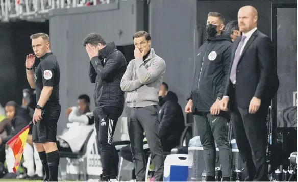  ??  ?? Fulham manager Scott Parker (centre) reacts on the touchline during the Premier League defeat at Craven Cottage.