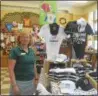  ?? JOSEPH PHELAN--JPHELAN@ DIGITALFIR­STMEDIA.COM ?? Co-owner of Impression­s of Saratoga, Marianne Barker, shows off the table dedicated to Triple Crown winner Justify.