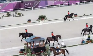  ?? (AFP) ?? Participan­ts from Denmark and Britain take part in the familiaris­ation for the equestrian dressage event at the Equestrian Park in Tokyo on July 21, 2021 ahead of the Tokyo 2020 Olympic Games.