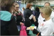  ??  ?? Samples are handed out at the 10th annual New York Women’s Expo.