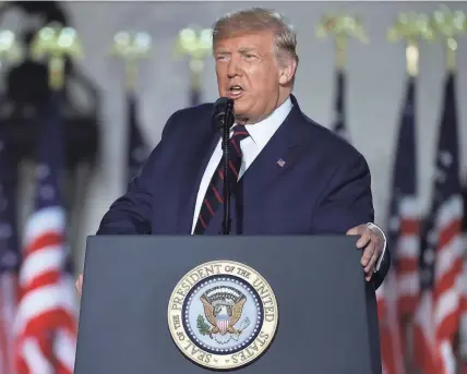  ?? GETTY IMAGES ?? President Donald Trump delivers his acceptance speech Thursday for the Republican presidenti­al nomination on the South Lawn of the White House. Trump gave the speech in front of 1,500 invited guests.