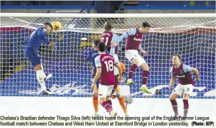  ?? (Photo: AFP) ?? Chelsea’s Brazilian defender Thiago Silva (left) heads home the opening goal of the English Premier League football match between Chelsea and West Ham United at Stamford Bridge in London yesterday.