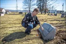  ??  ?? On March 3, Victoria George visits the gravestone and speaks to her mother, Frances Pierce, at the cemetery in Uniontown where her parents are buried.