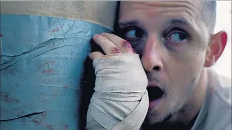  ?? TIFF ?? JAMIE BELL portrays a struggling Ohio dad who enters a brutal fighting scene to try to earn money and make life better for his family.