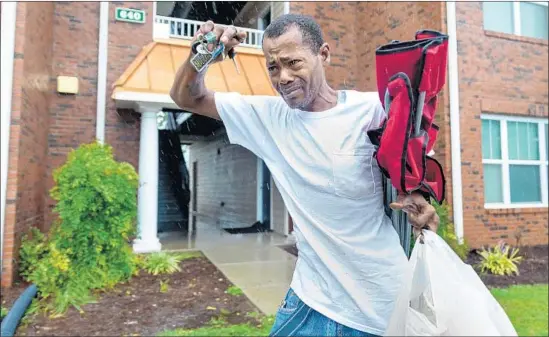  ?? Robert Gourley For The Times ?? ANTHONY EVANS, 52, leaves his home Sunday in Fayettevil­le, N.C. Two years ago, Hurricane Matthew forced him and his wife to live in a motel for two months.