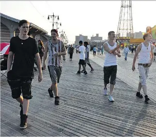  ?? PHOTOS: MONGREL MEDIA ?? Boyhood friends Frankie (Harris Dickinson), Nick (Frank Hakaj), Alexei (David Ivanov) and Jesse (Anton Selyaninov) prowl the Coney Island boardwalk at sunset in Beach Rats.