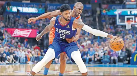  ?? [BRYAN TERRY/ THE OKLAHOMAN] ?? Oklahoma City's Chris Paul (3) defends LA's Paul George (13) during Sunday night's game at Chesapeake Energy Arena in Oklahoma City. Oklahoma City won 118-112 in George's return to OKC as a Clipper .