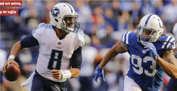  ?? Michael Reaves / Getty Images ?? Despite Marcus Mariota’s pedestrian numbers, the Titans are tied with the Jaguars atop the AFC South.