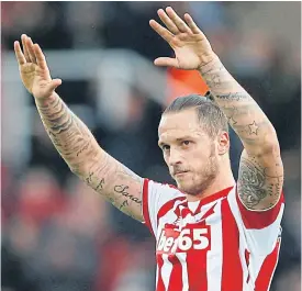  ??  ?? Stoke’s Marko Arnautovic acknowledg­es fans after their Manchester City win.