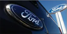  ?? CHARLES KRUPA — THE ASSOCIATED PRESS ?? Ford Motor Co. has settled claims by 40U.S. state attorneys general over claims about its C-Max hybrid cars and Super Duty pickup trucks.