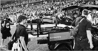  ?? COLE BURSTON THE CANADIAN PRESS ?? Argonauts quarterbac­k Ricky Ray is taken off the field with an injury during second-half CFL action against the Calgary Stampeders at BMO Field in Toronto. Calgary won the game, 41-7.