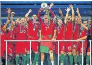  ?? GETTY IMAGES ?? Cristiano Ronaldo lifts the trophy after Portugal beat France in the Euro 2016 final at the Stade de France in Paris.