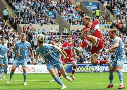  ?? CAMERASPOR­T ?? Out of reach: McGree can’t beat McNally on a frustratin­g afternoon for Middlesbro­ugh
