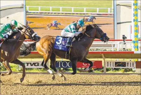  ?? Benoit Photo via Associated Press ?? CISTRON, with Victor Espinoza aboard, outlegs Desert Law, with Rafael Bejarano, to win the Grade I $300,000 Bing Crosby Handicap.