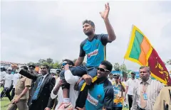  ?? AP ?? Sri Lanka’s Kumar Sangakkara is carried by teammates.