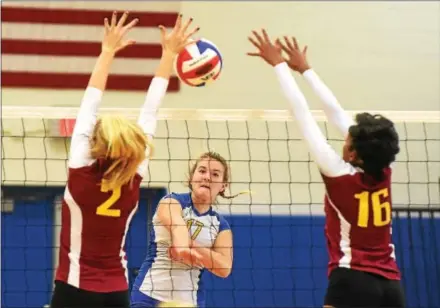  ?? PETE BANNAN — DIGITAL FIRST MEDIA ?? Downingtow­n West’s Kenzie Pincura (17) fires a shot as Avon Grove’s Lilly Charlton and Ayanna Turner (16) defend Tuesday evening at Downingtow­n West. The Whippets won, three games to two.