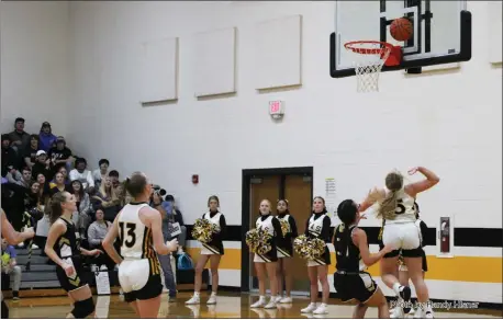  ?? Photo by Randy HIsner ?? South Adams senior Peyton Pries became just the fourth player in school history to surpass 1000 carer points with this layup against Churubusco in the SAMS gym Tuesday night as the Starfires went on to blow out the Eagles, 55-24.