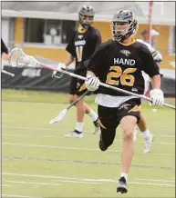  ?? Dave Phillips / For Hearst Connecticu­t Media ?? Hand’s Seth Sweitzer handles the ball against Weston during the Class M championsh­ip in June in Trumbull.