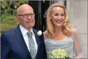  ?? JOHN STILLWELL — THE ASSOCIATED PRESS ?? Media mogul Rupert Murdoch and Jerry Hall pose outside St Bride's Church in London for their wedding in 2016.